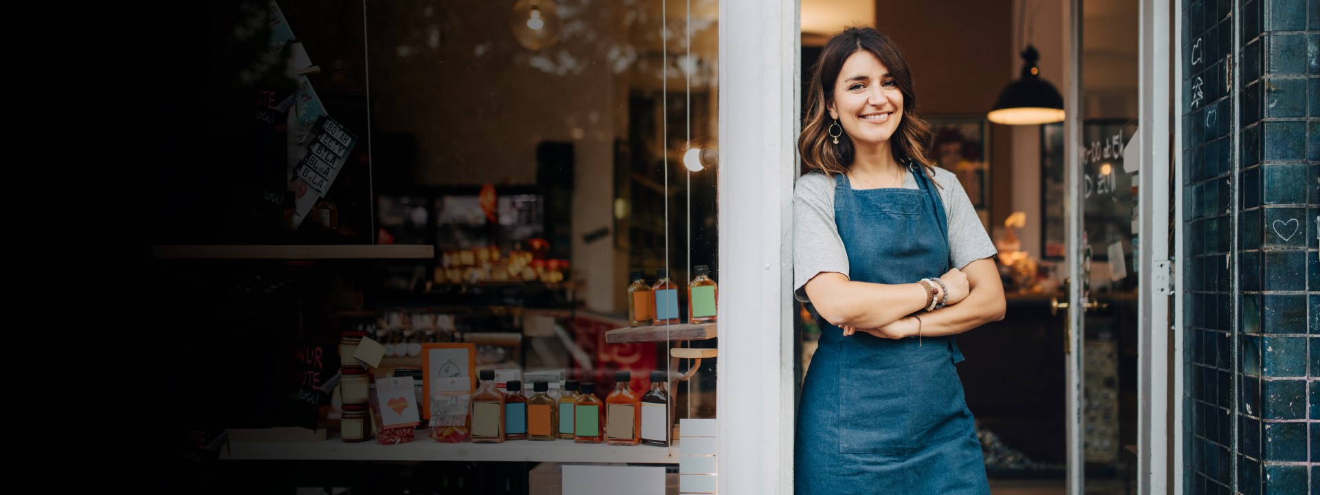 Smiling woman outside her shop